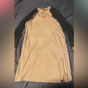 Tan dress,see through black dot arms. Has a little thigh slit in dress. Sexy